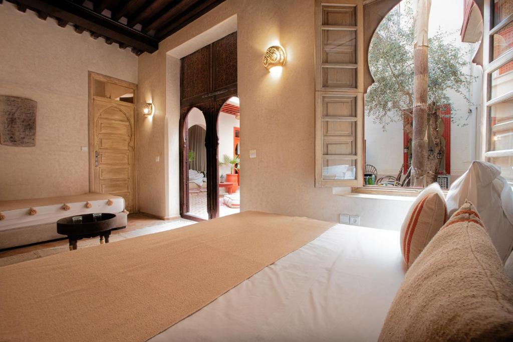 Postel nebo postele na pokoji v ubytování Riad Tassili Marrakech