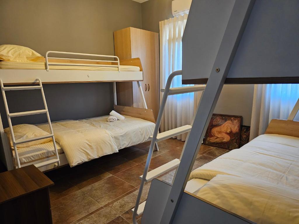 Postel nebo postele na pokoji v ubytování Hani i Ilirit