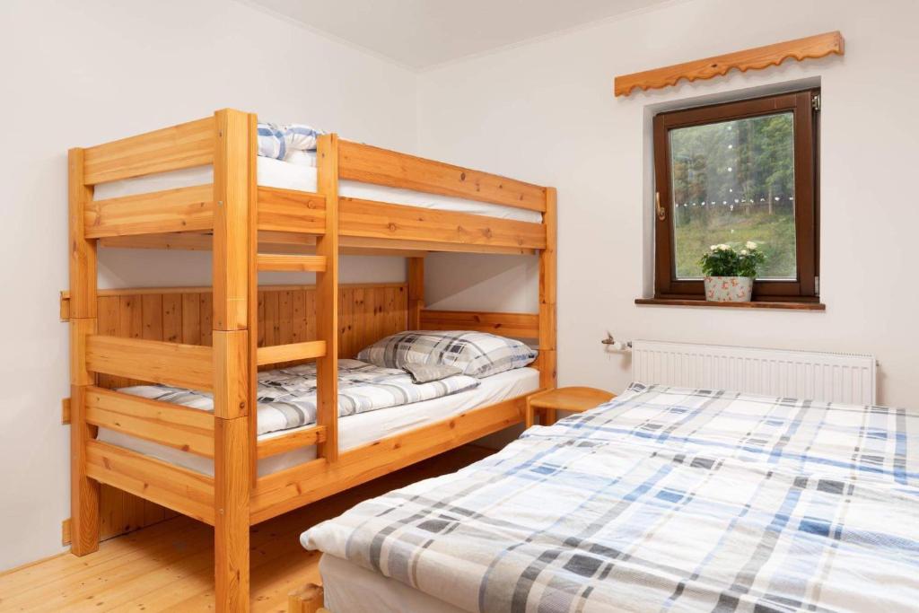 Postel nebo postele na pokoji v ubytování Penzion ZOE
