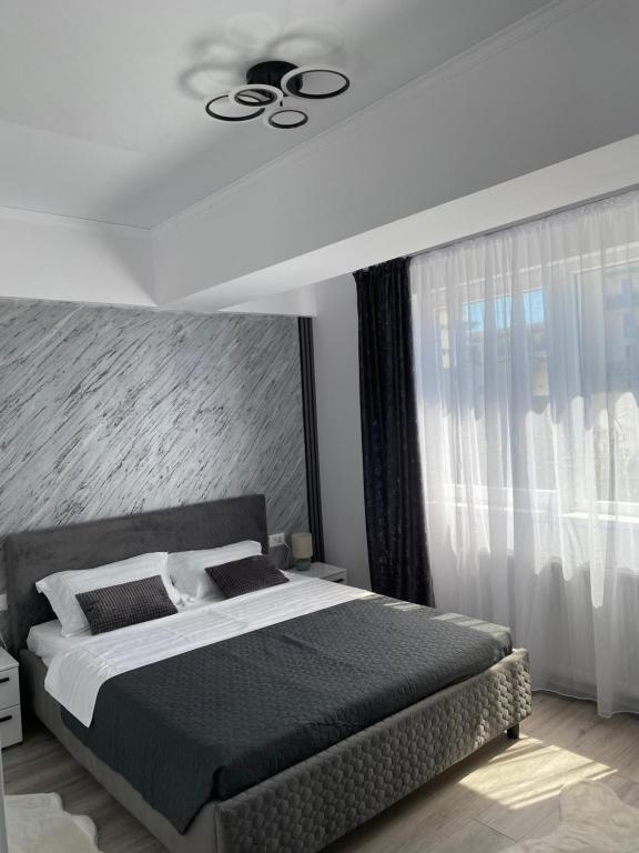 Postel nebo postele na pokoji v ubytování Apartament Modern Mamaia Nord