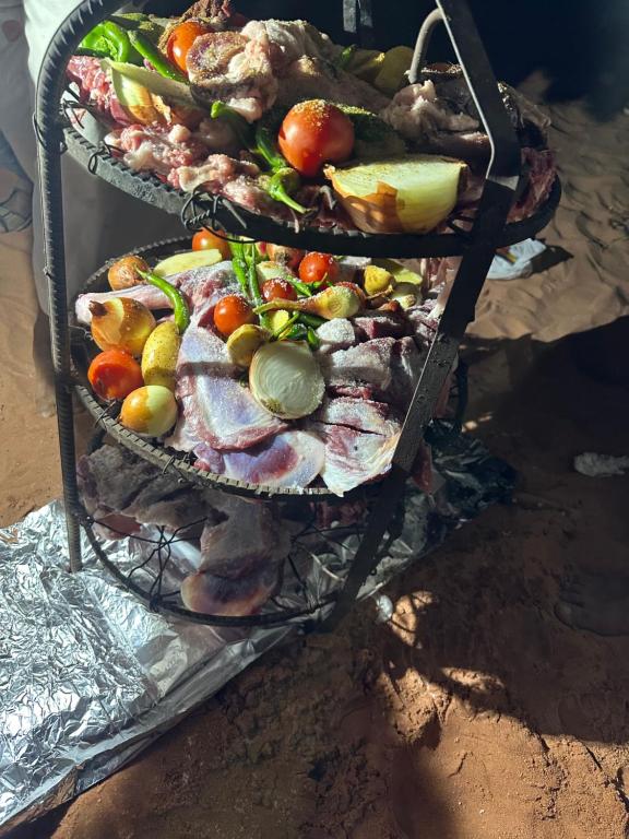 two baskets filled with different types of fruits and vegetables at Bubbles Desert Camp Jeep Tours in Wadi Rum