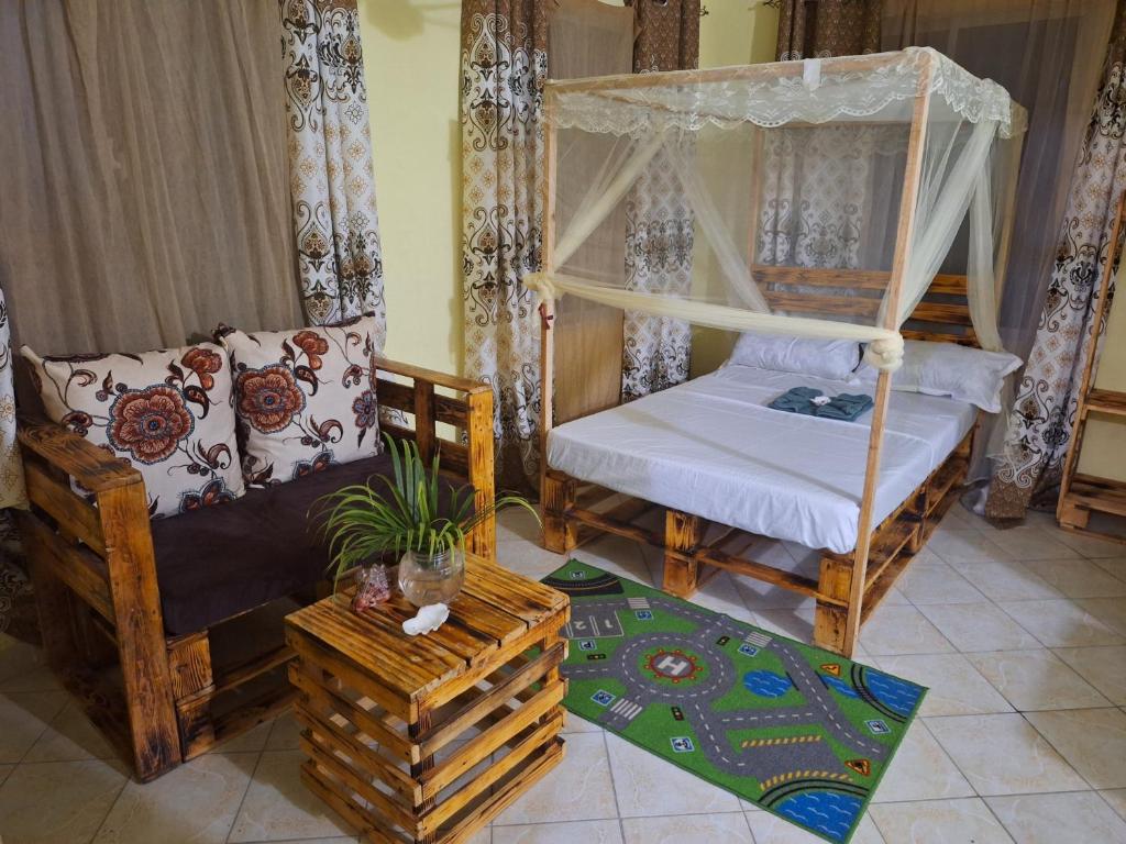Letto o letti in una camera di Mount Zion Guest House, Mtwapa Mtomondoni
