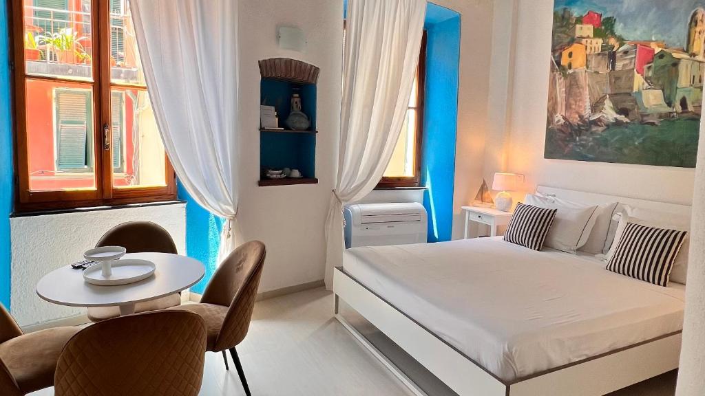 Postel nebo postele na pokoji v ubytování La Polena Camere Vernazza - Visconti Apartment