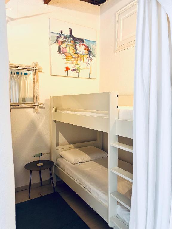 Postel nebo postele na pokoji v ubytování La Polena Camere Vernazza - Visconti Apartment