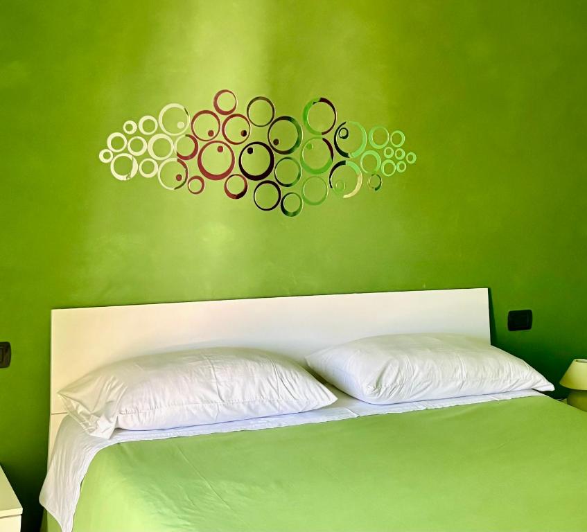 A bed or beds in a room at Color House Malpensa B&B