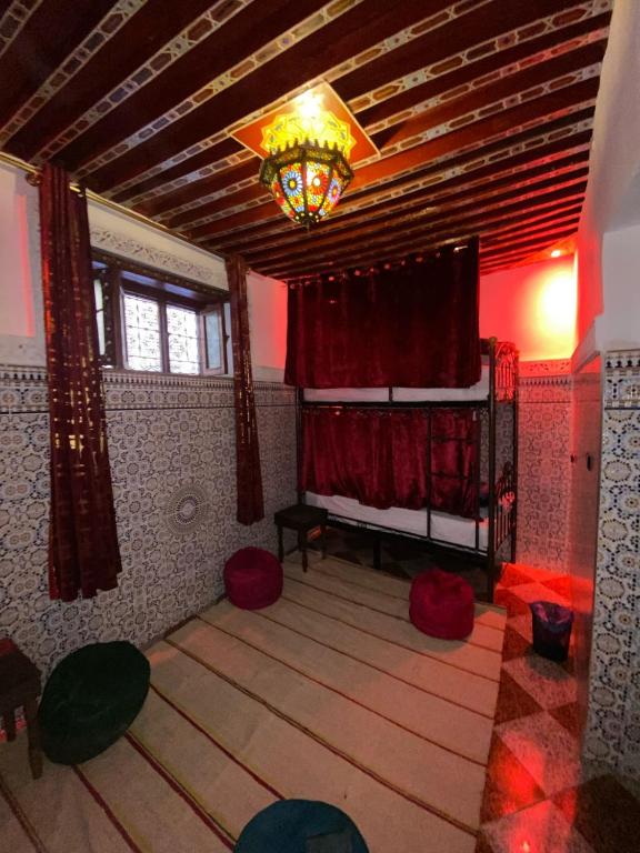 Postel nebo postele na pokoji v ubytování Downtown Hostel