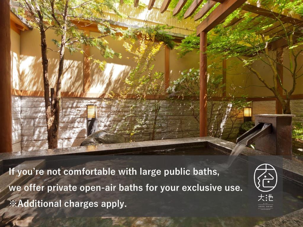 a sign that says if youre not comfortable with large public baths at Oike Hotel in Fujikawaguchiko