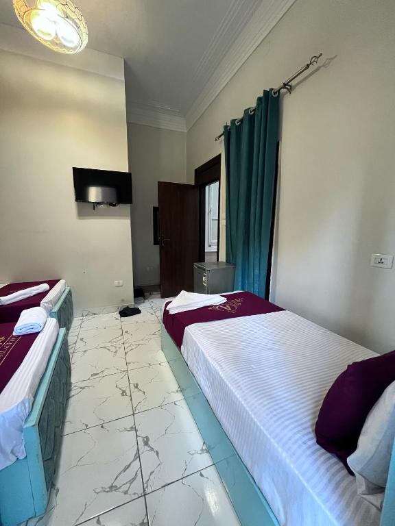 Postel nebo postele na pokoji v ubytování Abdeen Cairo Hostel