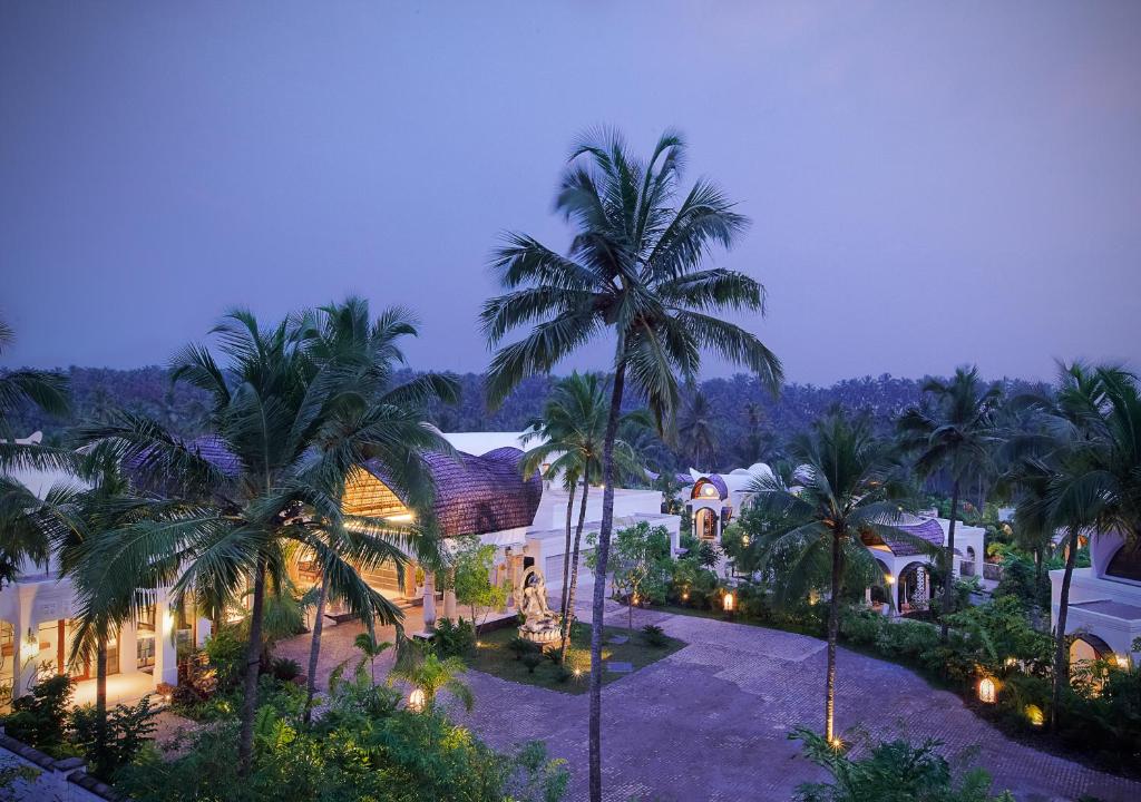 an aerial view of a house with palm trees at Taj Bekal Resort & Spa, Kerala in Bekal