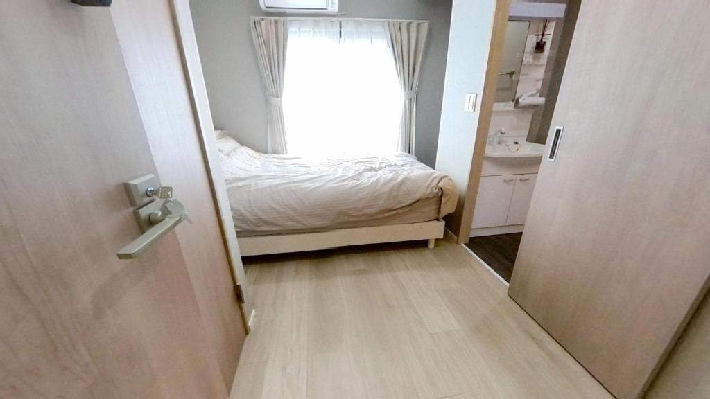 Postel nebo postele na pokoji v ubytování ホテルYado SK 新小岩 駅徒歩4分
