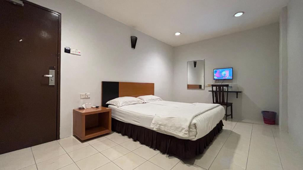 Postel nebo postele na pokoji v ubytování Hotel Centum
