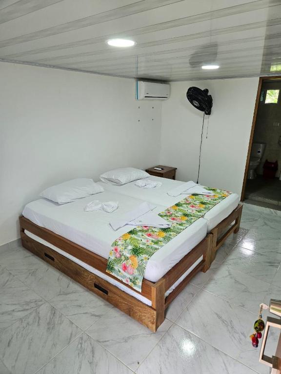 Postel nebo postele na pokoji v ubytování Hotel Nuquimar