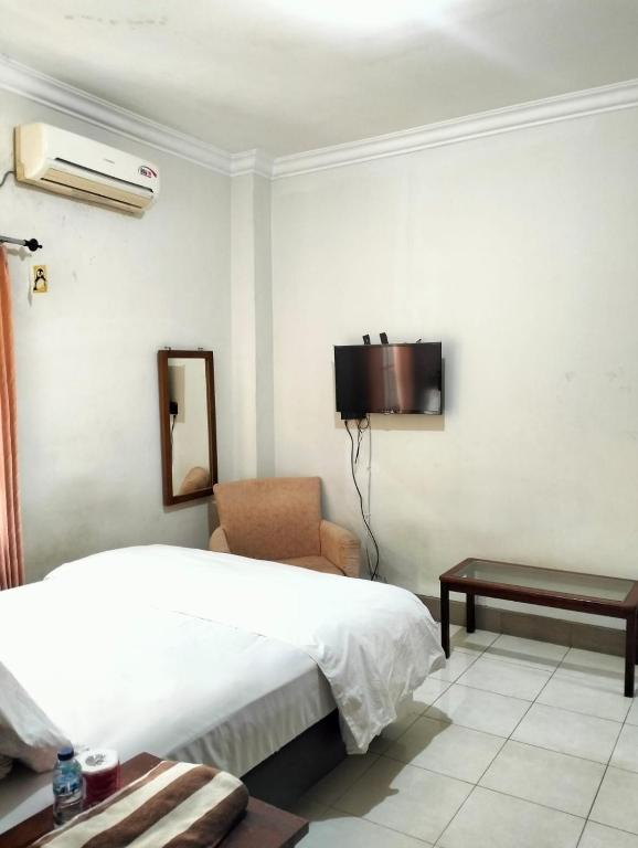 Postel nebo postele na pokoji v ubytování Nakula Familiar Inn