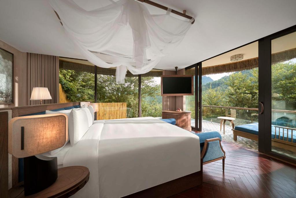 Giường trong phòng chung tại Garrya Mù Cang Chải