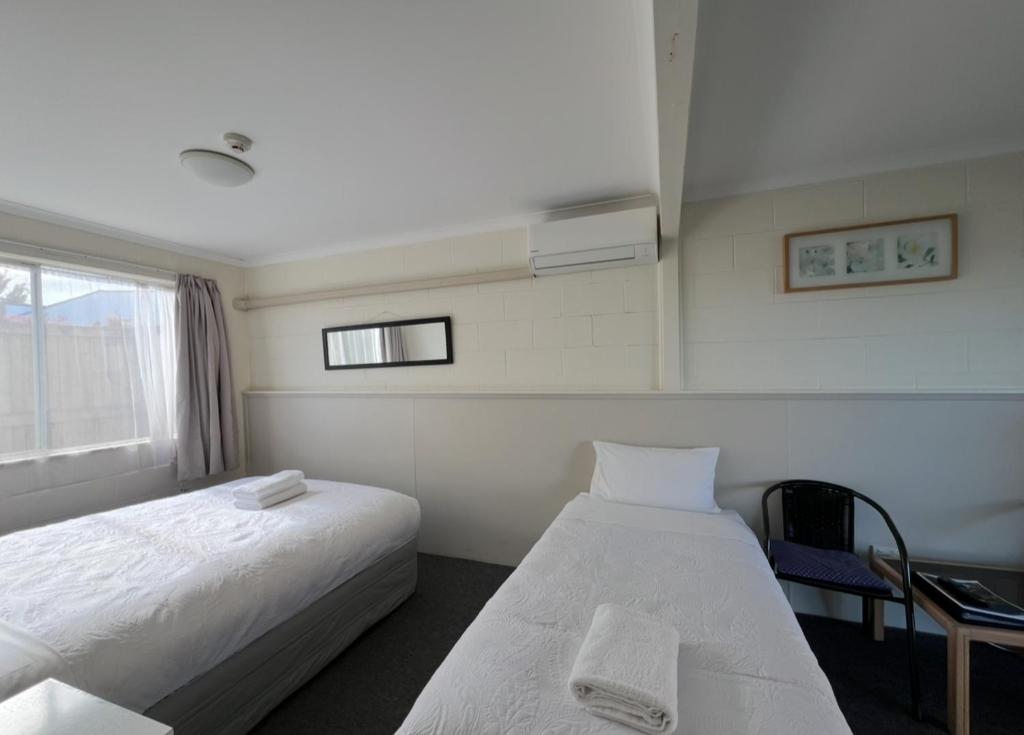 Postel nebo postele na pokoji v ubytování Mountain View Motel
