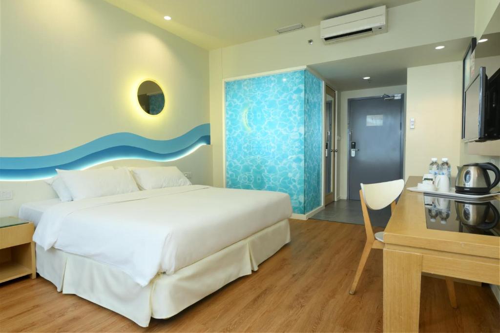 Postel nebo postele na pokoji v ubytování Oceania Hotel