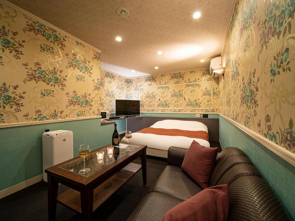 Postel nebo postele na pokoji v ubytování Hotel Rakuseki Honkan
