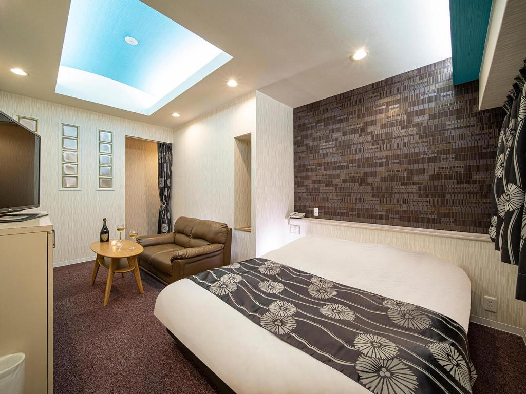 Postel nebo postele na pokoji v ubytování Hotel Rakuseki Honkan