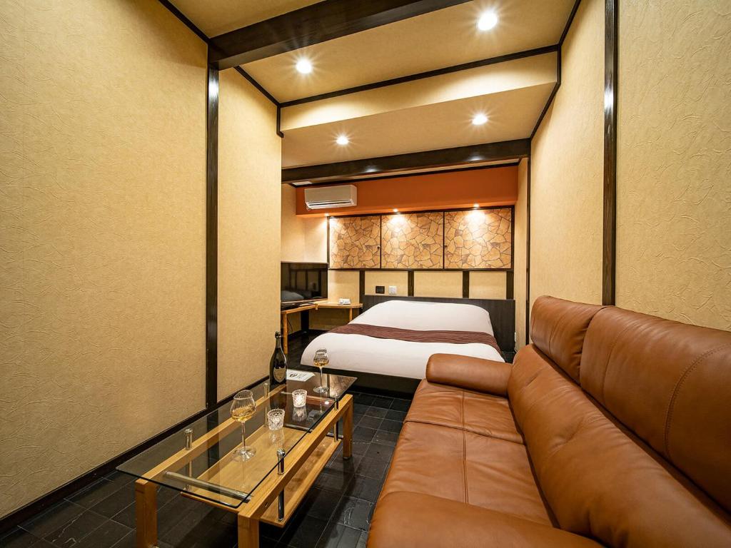 Postel nebo postele na pokoji v ubytování Hotel Rakuseki Honkan