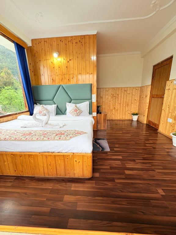 Postel nebo postele na pokoji v ubytování Hotel Suraj Retreat Inn