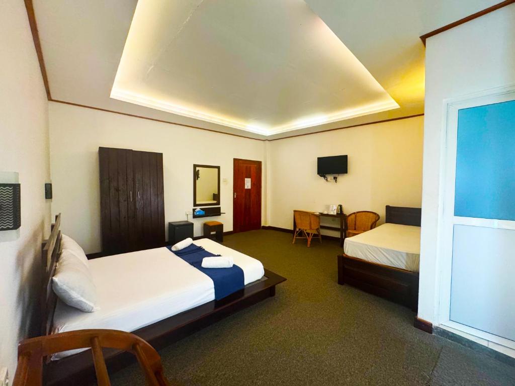 Postel nebo postele na pokoji v ubytování Nico Lagoon Hotel