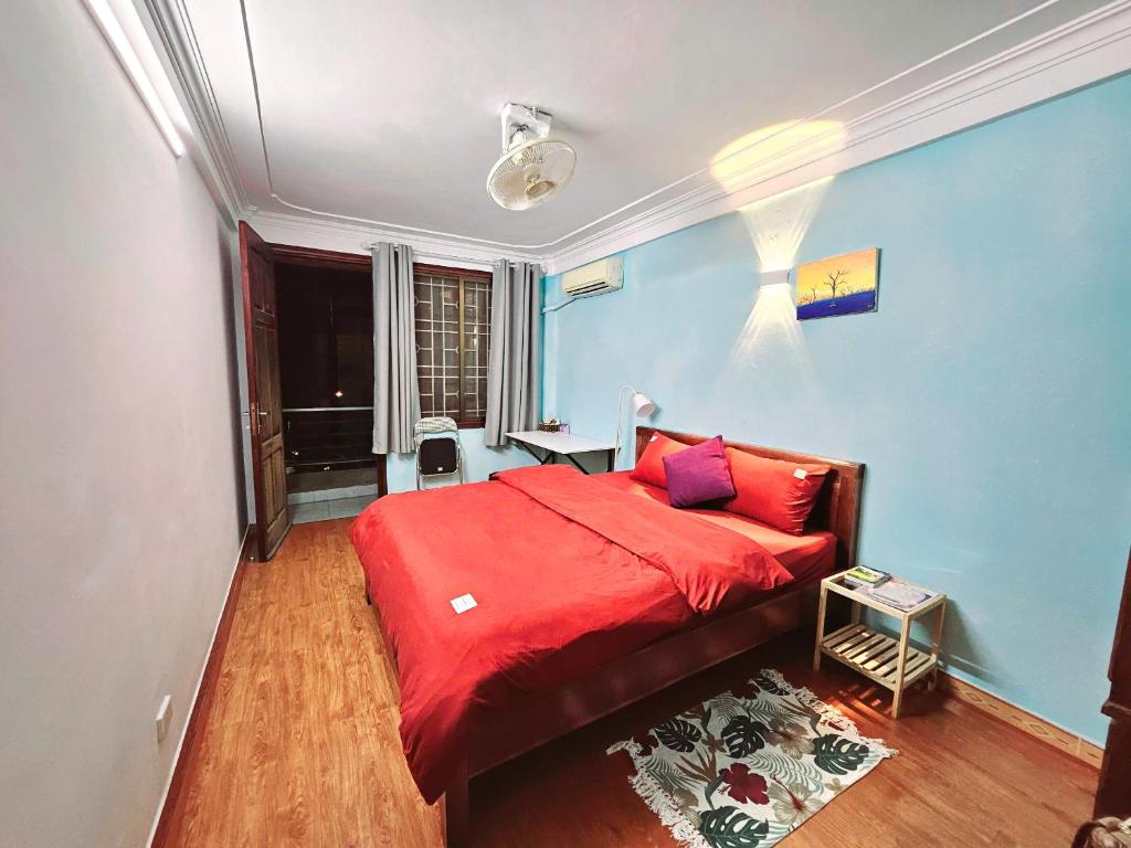 Postel nebo postele na pokoji v ubytování Rainbow HomeStay - No 8 Alley 18B Tong Dan