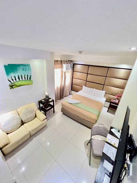 Postel nebo postele na pokoji v ubytování Canberry Hotel
