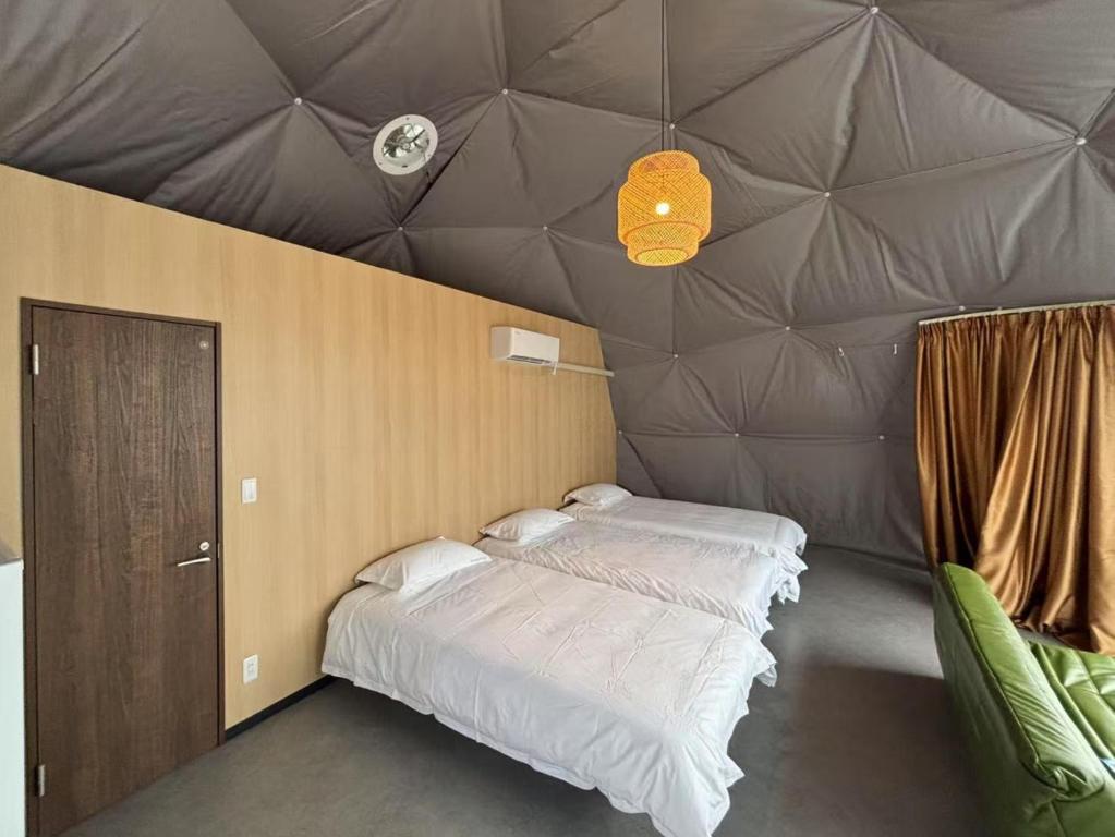 Postel nebo postele na pokoji v ubytování ポセイドン グランピング Poseidon Glamping