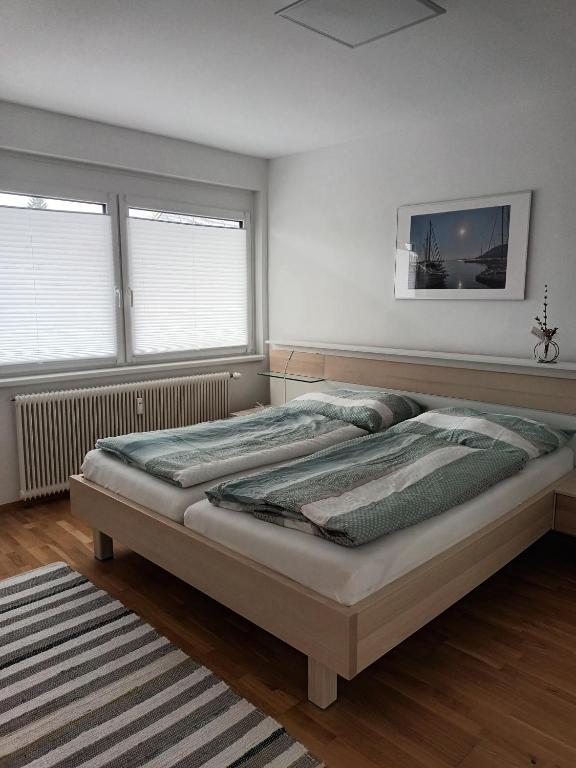 Postel nebo postele na pokoji v ubytování Appartement Kärntner Seenland
