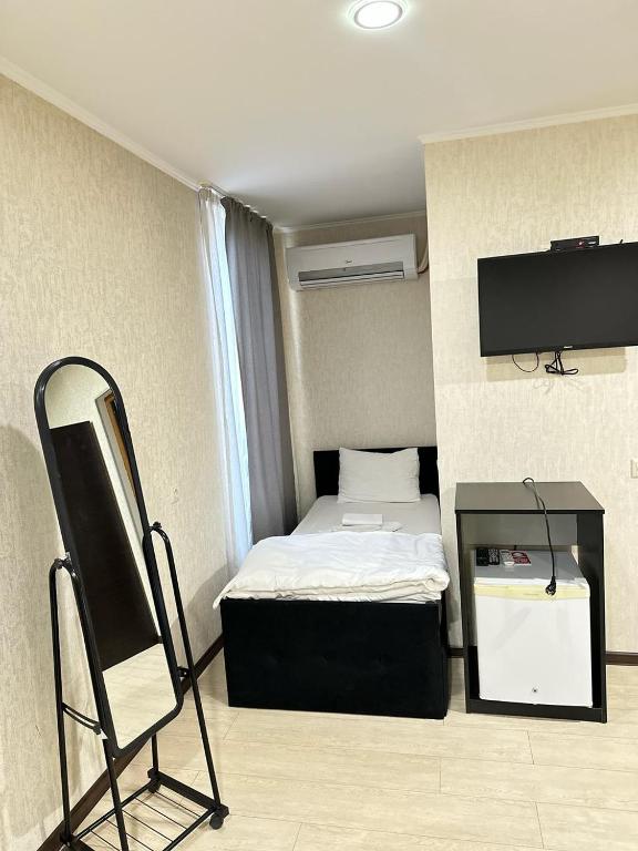 Postel nebo postele na pokoji v ubytování Noako Rooms Hotel
