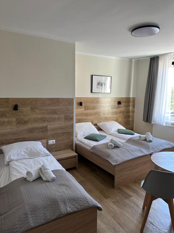 Posteľ alebo postele v izbe v ubytovaní Apartament, Pokoje Koniczynka