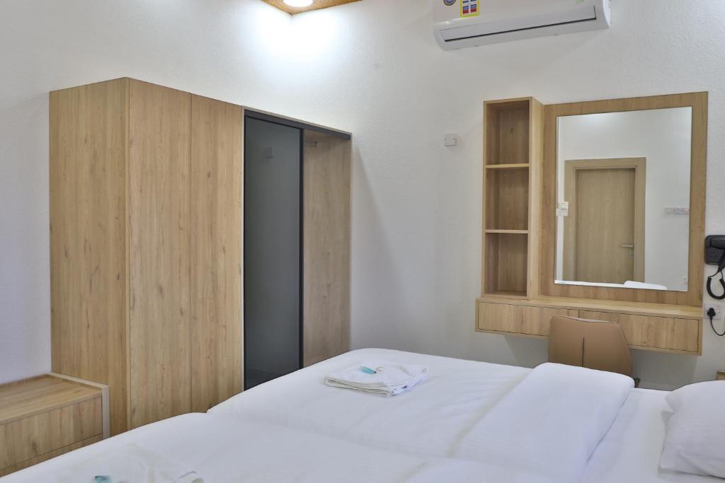 Postel nebo postele na pokoji v ubytování Darunique Inn
