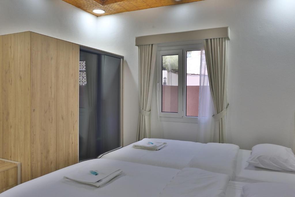 Postel nebo postele na pokoji v ubytování Darunique Inn