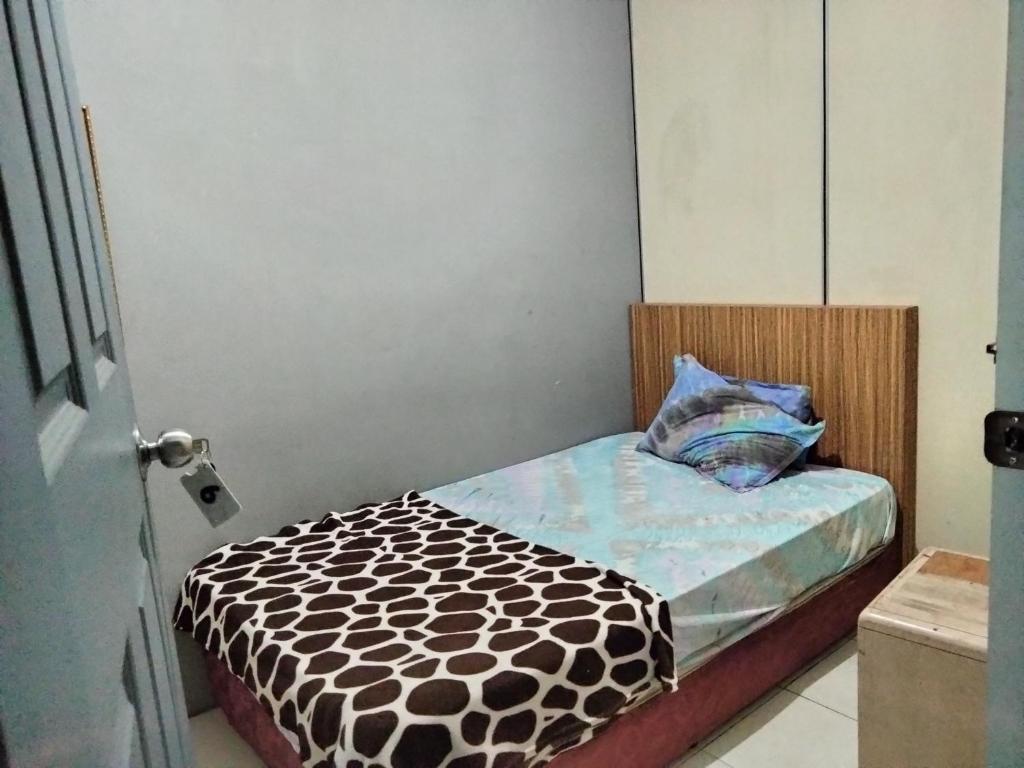 Postel nebo postele na pokoji v ubytování Hotel Bajet DNOOR Kota Bharu