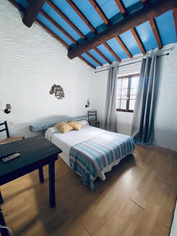 Postel nebo postele na pokoji v ubytování Hôtel MAS DE LAYALLE