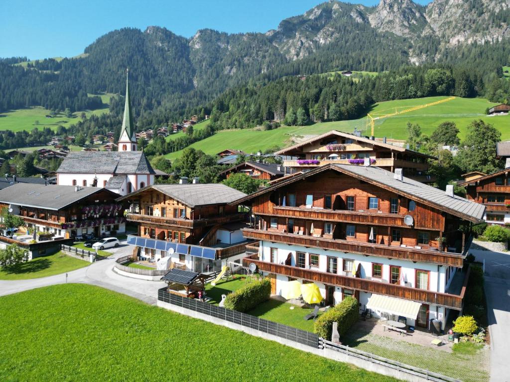 an aerial view of a village with a church at Appartement Moaeben in Alpbach