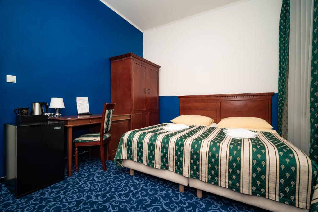Postel nebo postele na pokoji v ubytování Hotel Czechia