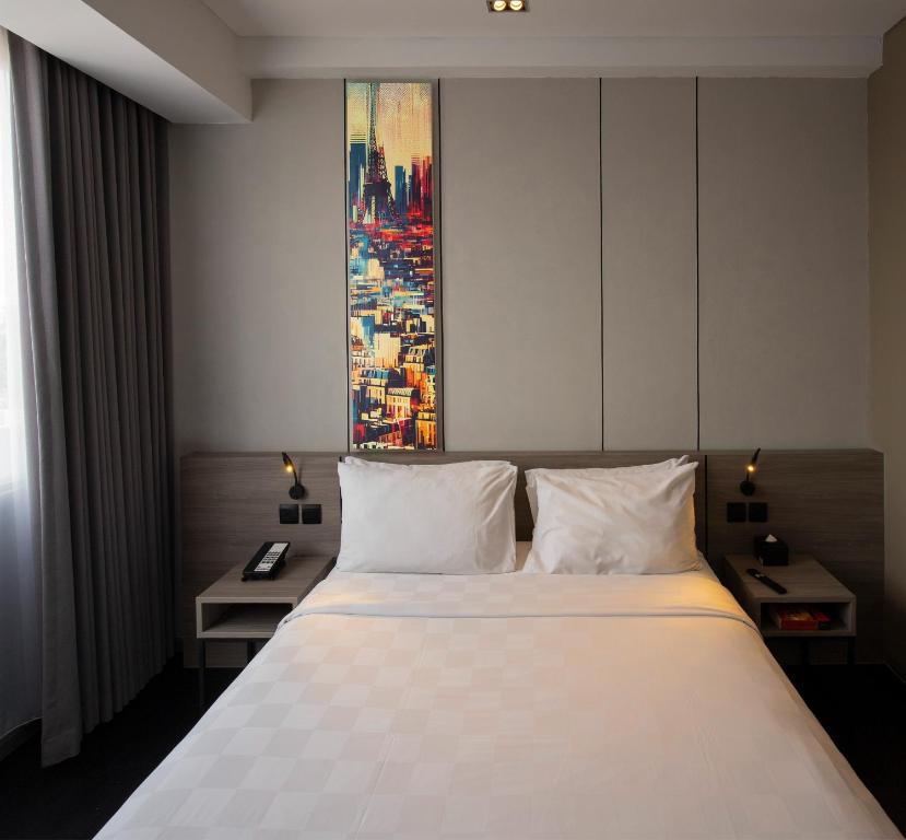 Postel nebo postele na pokoji v ubytování Citadines Connect Airport Jakarta