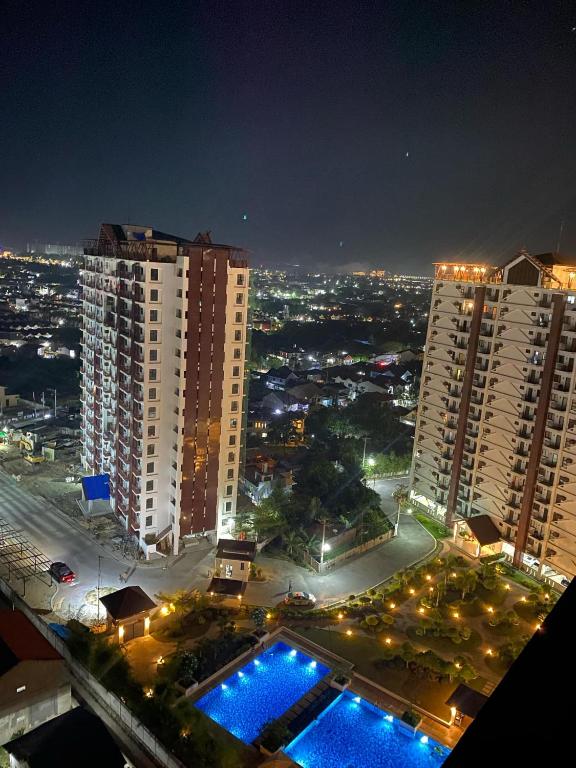 a view of a city at night with tall buildings at My Condo City in Lapu Lapu City