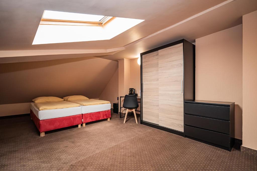 Postel nebo postele na pokoji v ubytování Hotel Czechia