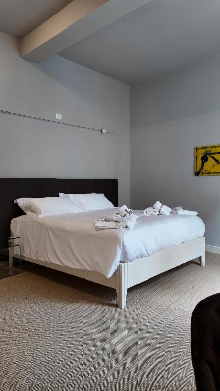 Postel nebo postele na pokoji v ubytování Amelié Lago d’Orta Hotel