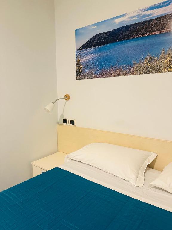 Postel nebo postele na pokoji v ubytování Lido Di Procida Guest House