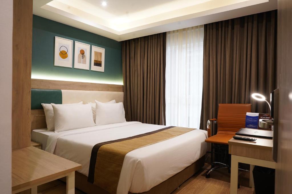Postel nebo postele na pokoji v ubytování Sarovar Portico Kolkata