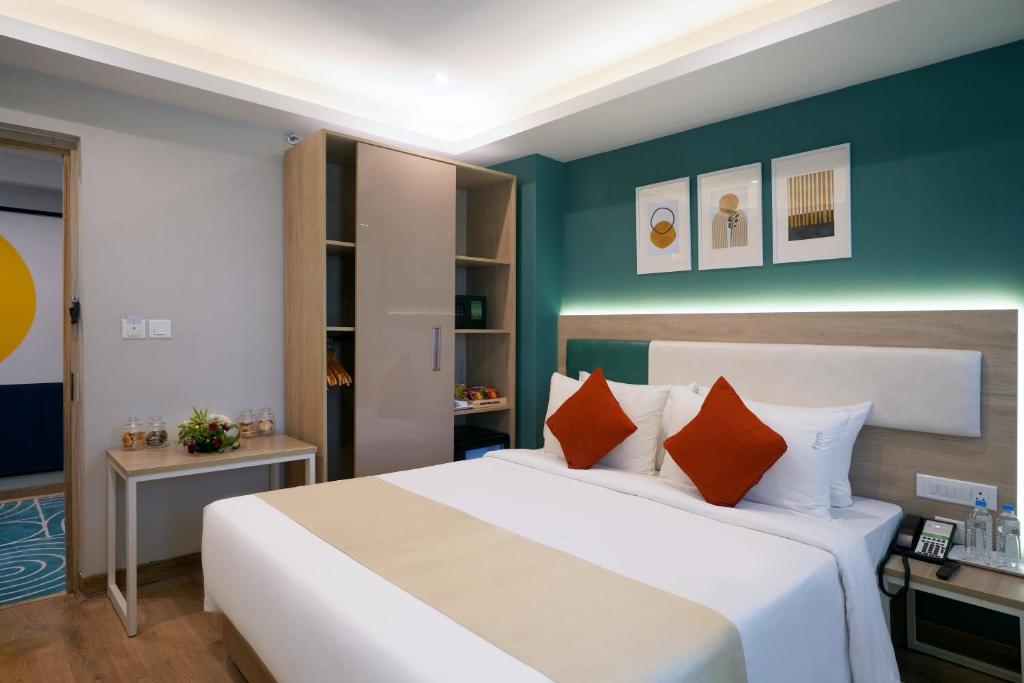 Postel nebo postele na pokoji v ubytování Sarovar Portico Kolkata