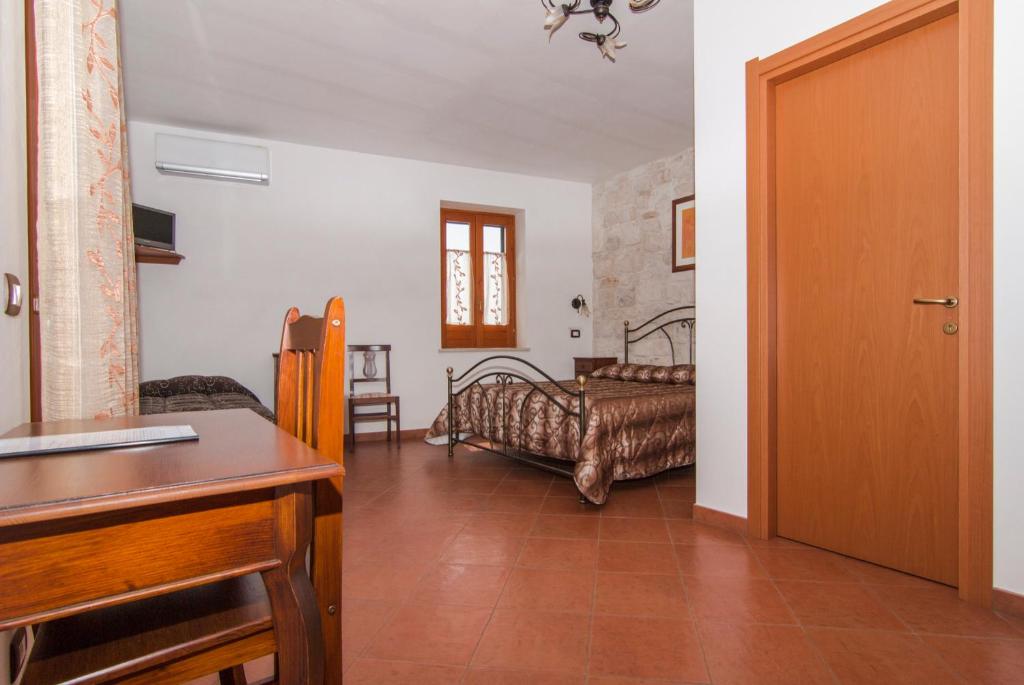 Postel nebo postele na pokoji v ubytování B&B Il Giardino Dei Mandarini