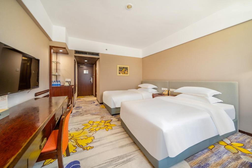 TV a/nebo společenská místnost v ubytování Zhongshan International Hotel