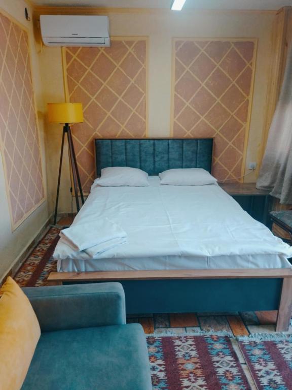 Postel nebo postele na pokoji v ubytování Old Capital
