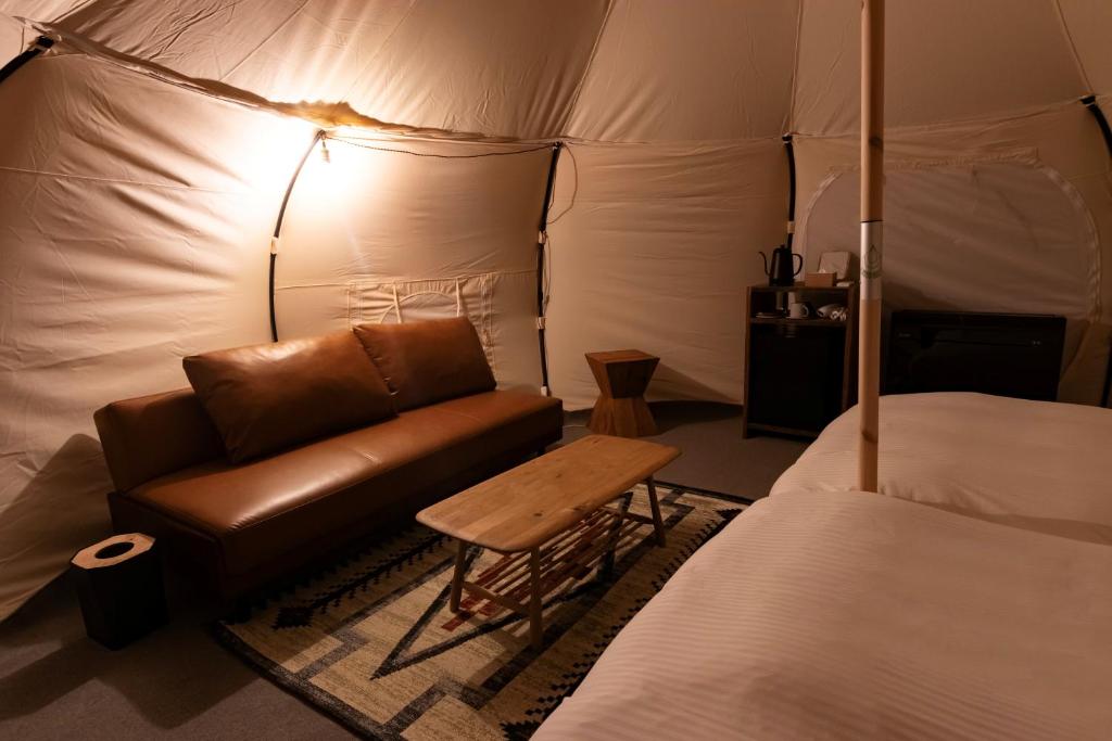 Postel nebo postele na pokoji v ubytování 淡路島ヴィラ Lazy Inn.