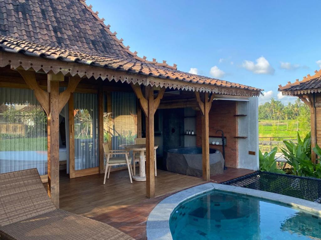 Bazén v ubytování DITUJU Ubud by Pramana Villas nebo v jeho okolí