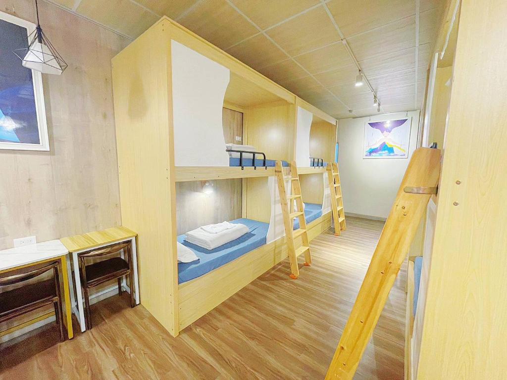 Postel nebo postele na pokoji v ubytování 中華郵輪文旅
